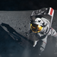 An image of an artist's illustration of an astronaut stepping from a Moon lander onto the lunar surface